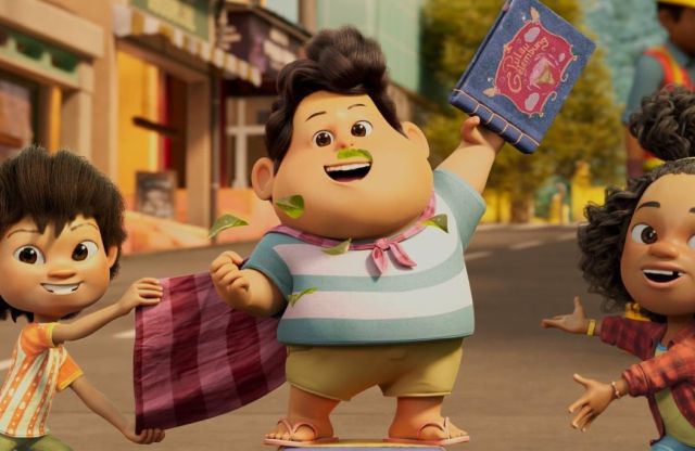 Tiga karakter utama dalam film animasi "Jumbo" sedang berpose ceria di jalanan kota, dengan karakter utama menggenggam buku dan tersenyum lebar.