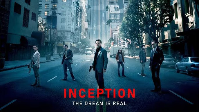 Gambar poster film Inception (2010), dengan Dom Cobb (Leonardo DiCaprio) dan timnya, menunjukkan mereka berdiri di tengah jalan kota yang terdistorsi, dengan teks "THE DREAM IS REAL."