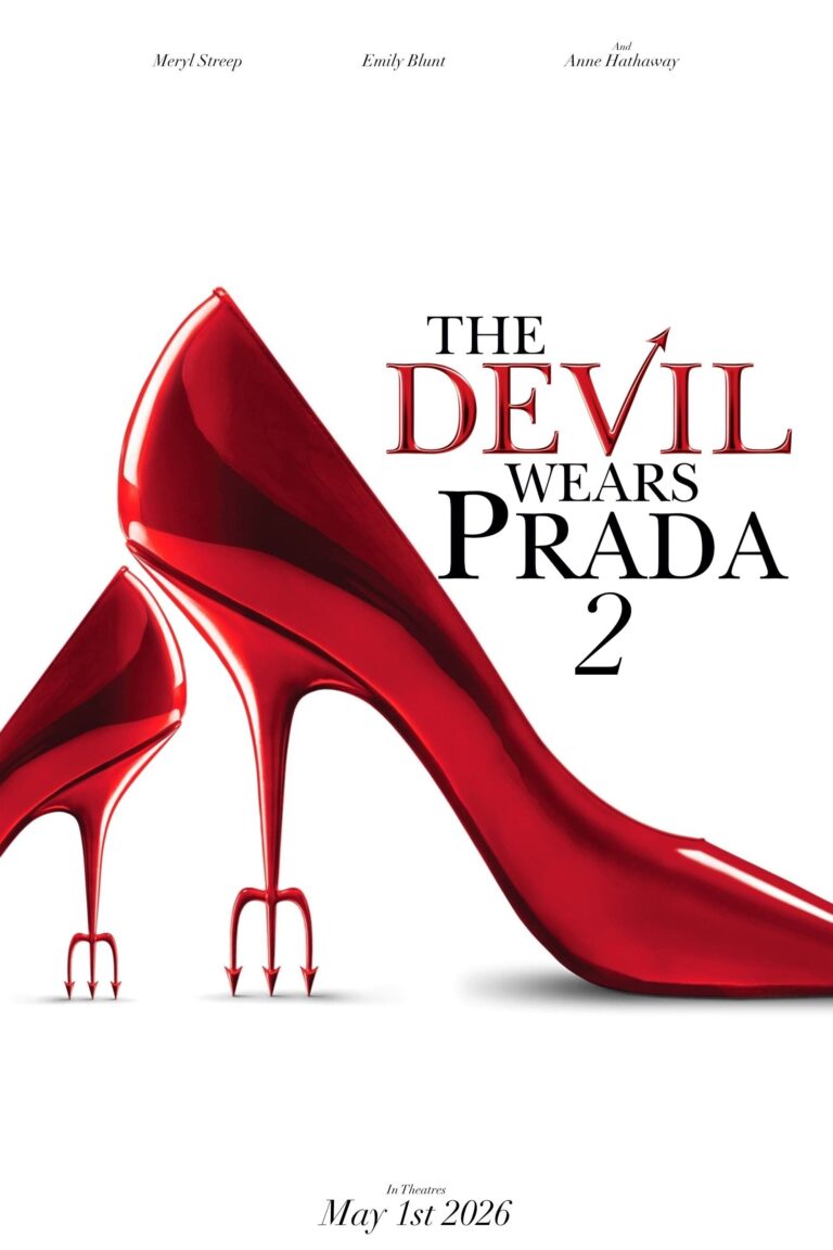Poster film minimalis untuk "The Devil Wears Prada 2" dengan latar belakang putih. Visual utama adalah dua sepatu hak tinggi merah mengkilap, satu besar dan satu kecil, dengan bagian tumit berbentuk garpu trisula iblis. Teks di bagian atas mencantumkan Meryl Streep, Emily Blunt, dan Anne Hathaway. Judul di tengah bertuliskan "THE DEVIL WEARS PRADA 2" dengan ekor iblis pada huruf V. Di bagian bawah tertulis tanggal rilis "In Theatres May 1st 2026